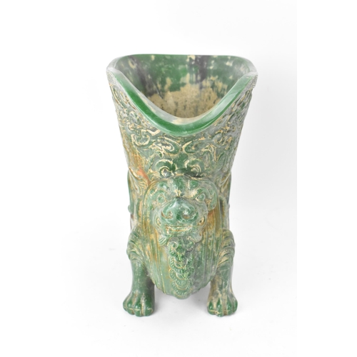 175 - A 20th century Chinese carved green soapstone vase/ drinking vessel, the upper vessel carved in reli... 