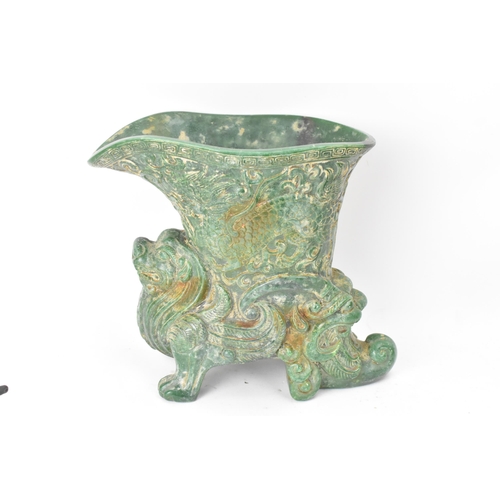 175 - A 20th century Chinese carved green soapstone vase/ drinking vessel, the upper vessel carved in reli... 