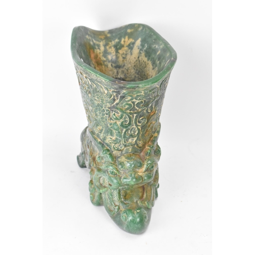 175 - A 20th century Chinese carved green soapstone vase/ drinking vessel, the upper vessel carved in reli... 