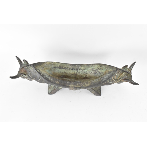 179 - A 20th century Chinese patinated bronzed oblong shaped bowl, the sides fashioned as two bulls heads ... 