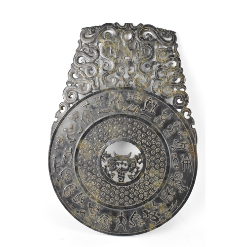 180 - A Chinese nephrite jade BI disk, relief carved with ancient script, repeated motif, pierced roundel ... 