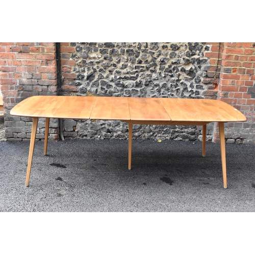 200 - A vintage Ercol elm and beech extending dining table with one folding leaf, on four splayed square t... 