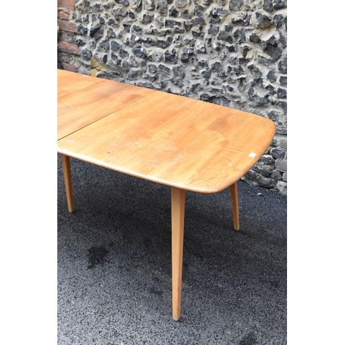 200 - A vintage Ercol elm and beech extending dining table with one folding leaf, on four splayed square t... 