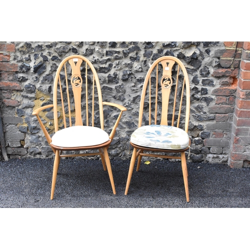 201 - An Ercol vintage gold label, elm seated and beech framed swan back carver chair and matching dining ... 