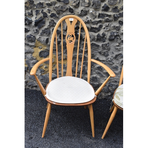 201 - An Ercol vintage gold label, elm seated and beech framed swan back carver chair and matching dining ... 