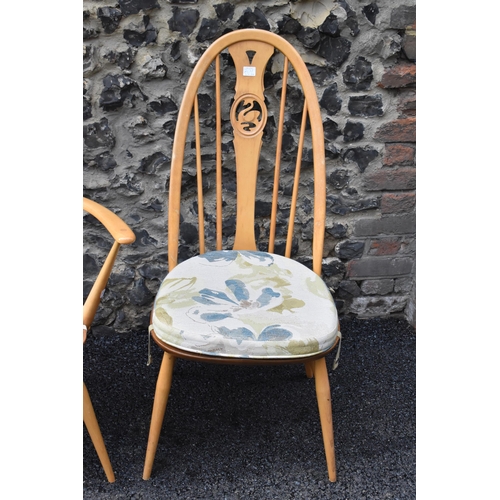 201 - An Ercol vintage gold label, elm seated and beech framed swan back carver chair and matching dining ... 