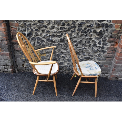 201 - An Ercol vintage gold label, elm seated and beech framed swan back carver chair and matching dining ... 