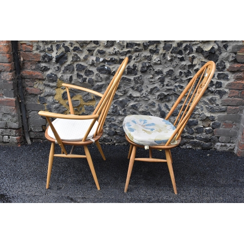 201 - An Ercol vintage gold label, elm seated and beech framed swan back carver chair and matching dining ... 