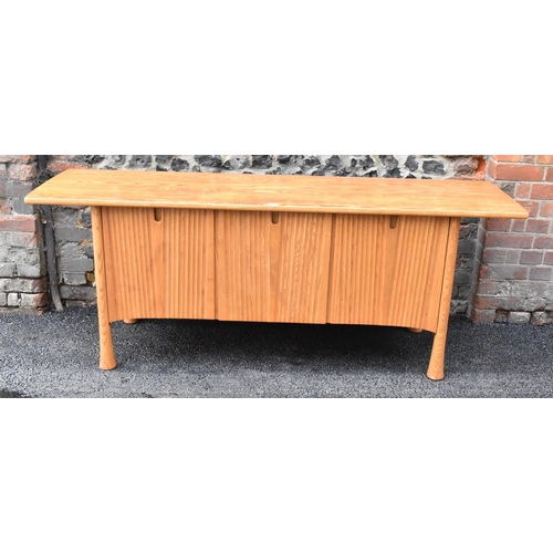 202 - A rare 20th century Ercol Saville elm sideboard The oversized plank top raised over a ridged base fi... 