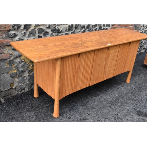 202 - A rare 20th century Ercol Saville elm sideboard The oversized plank top raised over a ridged base fi... 