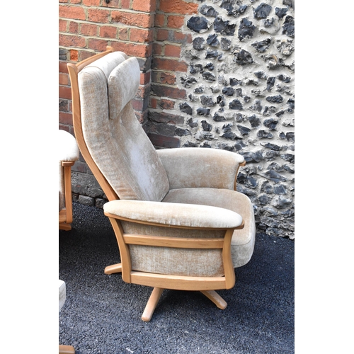 204 - A pair of vintage Ercol Gina light elm manual reclining armchairs upholstered in beige fabric with h... 