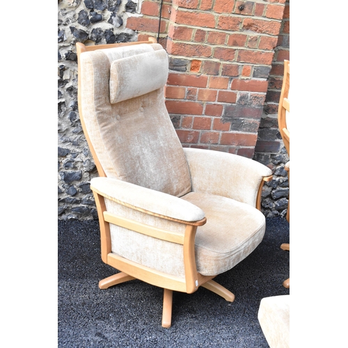 204 - A pair of vintage Ercol Gina light elm manual reclining armchairs upholstered in beige fabric with h... 