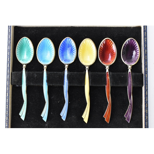 213 - A cased set of six mid 20th century coffee bean spoons, retailed by Harrods, all having guilloche en... 