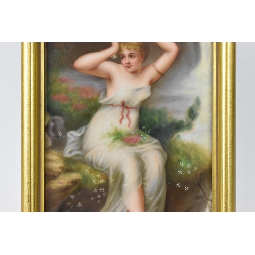 217 - A late 19th/early 20th century KPM style painted porcelain plaque depicting a maiden in a white dres... 