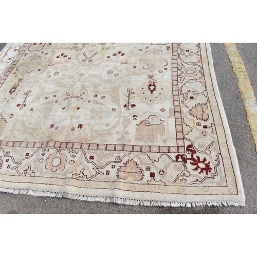 226 - A hand woven English design Zieglar Mahal rug, on a beige ground with repeating floral motifs, multi... 