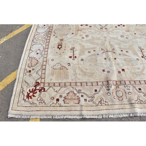 226 - A hand woven English design Zieglar Mahal rug, on a beige ground with repeating floral motifs, multi... 