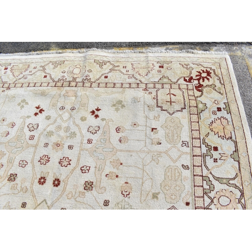 226 - A hand woven English design Zieglar Mahal rug, on a beige ground with repeating floral motifs, multi... 