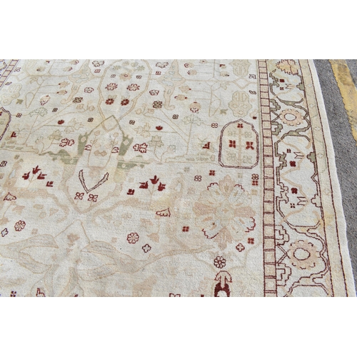 226 - A hand woven English design Zieglar Mahal rug, on a beige ground with repeating floral motifs, multi... 