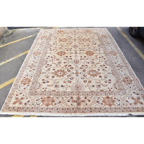 227 - A hand woven English design Zieglar Mahal rug, on a beige ground with repeating floral motifs, multi... 