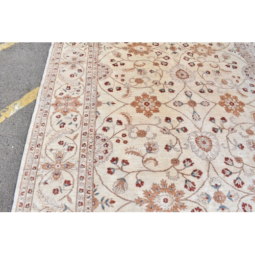 227 - A hand woven English design Zieglar Mahal rug, on a beige ground with repeating floral motifs, multi... 