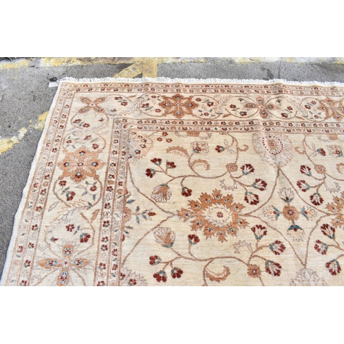 227 - A hand woven English design Zieglar Mahal rug, on a beige ground with repeating floral motifs, multi... 