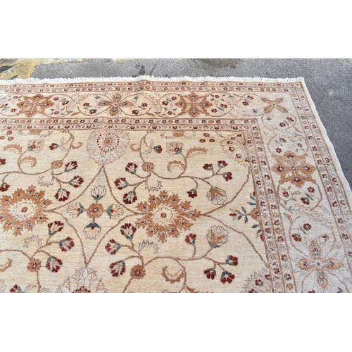 227 - A hand woven English design Zieglar Mahal rug, on a beige ground with repeating floral motifs, multi... 