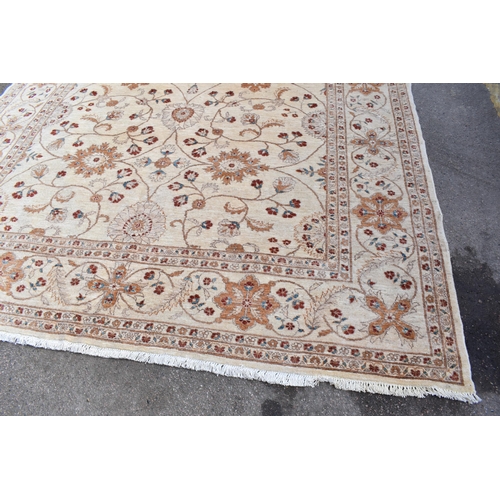 227 - A hand woven English design Zieglar Mahal rug, on a beige ground with repeating floral motifs, multi... 