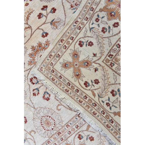 227 - A hand woven English design Zieglar Mahal rug, on a beige ground with repeating floral motifs, multi... 