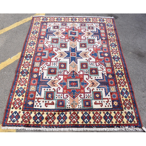 228 - A handwoven Caucasian star kazak rug, having a geometric designs with repeating motifs, multiguard b... 