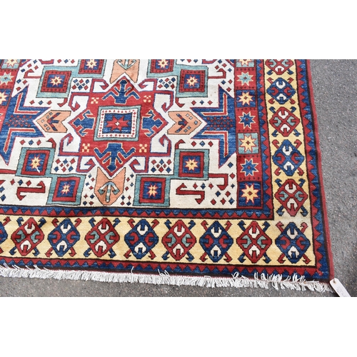 228 - A handwoven Caucasian star kazak rug, having a geometric designs with repeating motifs, multiguard b... 