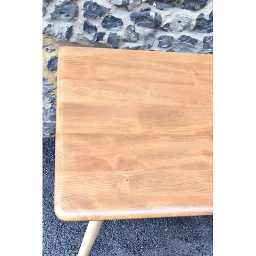 229 - A 1960s Ercol blonde elm and beech breakfast table, model 395, having a rectangular top with a spind... 