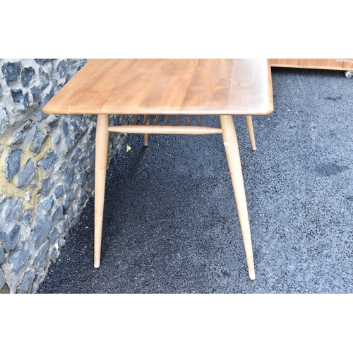 229 - A 1960s Ercol blonde elm and beech breakfast table, model 395, having a rectangular top with a spind... 