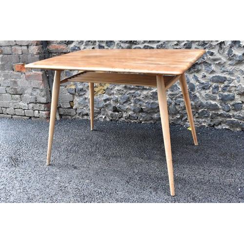 229 - A 1960s Ercol blonde elm and beech breakfast table, model 395, having a rectangular top with a spind... 