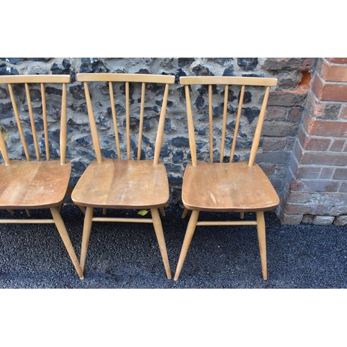 231 - A set of four Ercol blonde elm and beech kitchen dining chairs, model 391, having spindle stick back... 