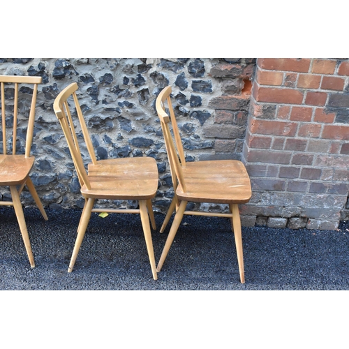 231 - A set of four Ercol blonde elm and beech kitchen dining chairs, model 391, having spindle stick back... 