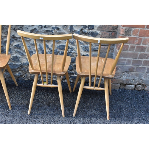 231 - A set of four Ercol blonde elm and beech kitchen dining chairs, model 391, having spindle stick back... 