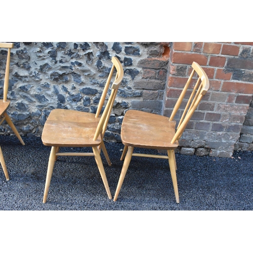 231 - A set of four Ercol blonde elm and beech kitchen dining chairs, model 391, having spindle stick back... 