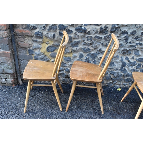 231 - A set of four Ercol blonde elm and beech kitchen dining chairs, model 391, having spindle stick back... 