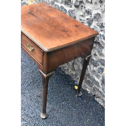 232 - A George II mahogany lowboy, having a rectangular top with rounded corners, two drawers with brass d... 