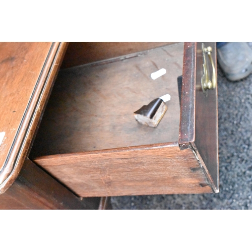 232 - A George II mahogany lowboy, having a rectangular top with rounded corners, two drawers with brass d... 