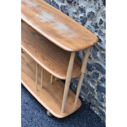 233 - A mid 20th century Ercol elm and beech Baby Giraffe three tier trolley, model 361, Windsor range, in... 