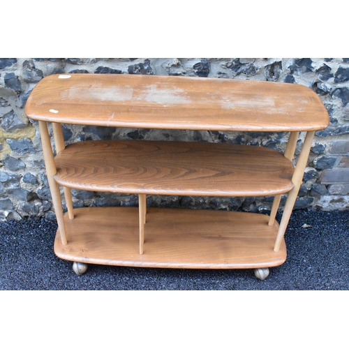 233 - A mid 20th century Ercol elm and beech Baby Giraffe three tier trolley, model 361, Windsor range, in... 