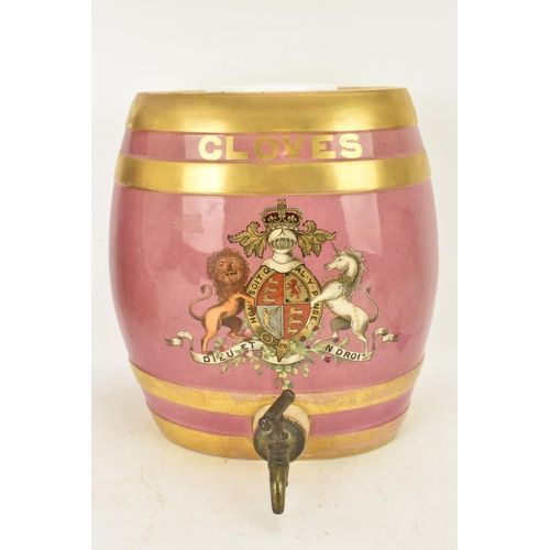 236 - A Victorian ceramic cloves barrel, of oval shape and decorated with a pink ground with gilt bands an... 