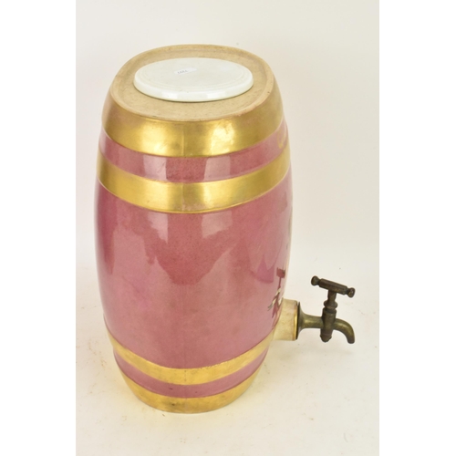 236 - A Victorian ceramic cloves barrel, of oval shape and decorated with a pink ground with gilt bands an... 