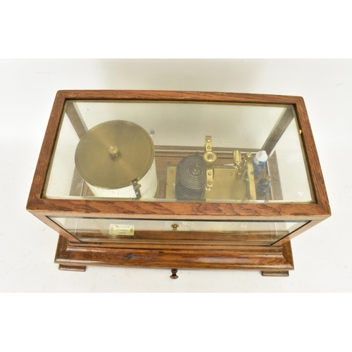 246 - An early 20th century barograph, the oak case with bevelled glass and chart drawer, labelled 'J Beck... 