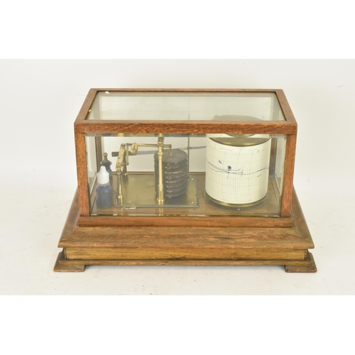 246 - An early 20th century barograph, the oak case with bevelled glass and chart drawer, labelled 'J Beck... 