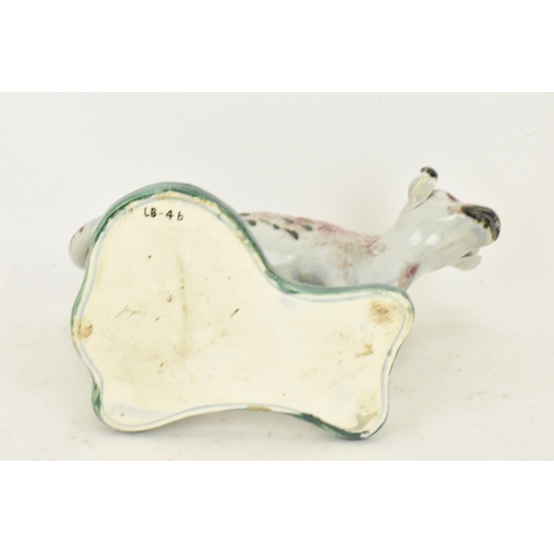 248 - Two early 19th century pearlware pink and green sponge decorated cow creamers with milkmaids, possib... 