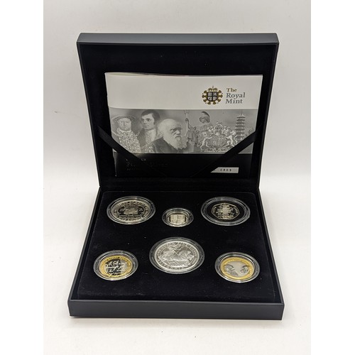 United Kingdom - Elizabeth II (1952-2022), Royal Mint 'The 2009 UK Family Silver Proof Collection', comprising of six coins with rare Kew Gardens 50p, £1 Shield, £2 Darwin, £2 Burns, £5 Henry VIII, £2 One Ounce Silver Britannia Coin, together with presentation box and Certificate,