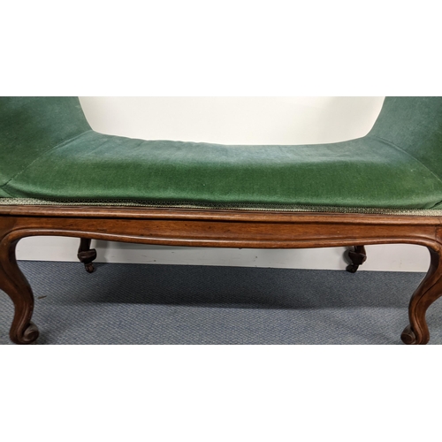 190 - A 19th century French walnut window seat having padded scroll ends, cabriole legs with carved scroll... 