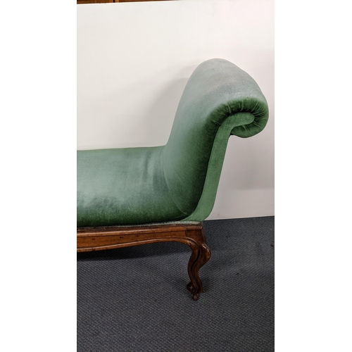 190 - A 19th century French walnut window seat having padded scroll ends, cabriole legs with carved scroll... 